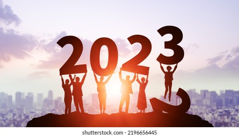 New year concept of 2023. New year's card. Multi ethnic people showing 2023.