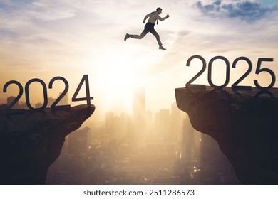 New year concept. Caucasian businessman jumping gap on the cliff from number 2024 to number 2025 - Powered by Shutterstock