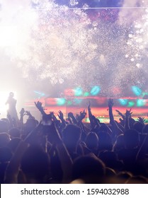 New Year concept - fireworks and cheering crowd celebrating the New Year