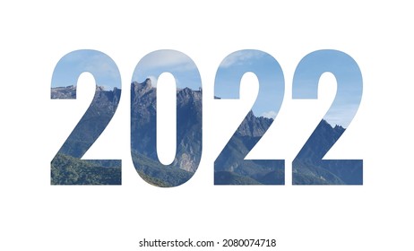 New Year Concept. White Paper Cut Out Number 2022 Layer Against Nature Background.