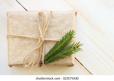 New year gift box handicraft wrapping, parchment twine fir tree twigs, cute simple last minute present handmade - Powered by Shutterstock