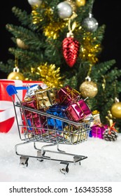 New Year Gift Boxes In Shopping Cart On Snow