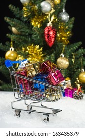 New Year Gift Boxes In Shopping Cart On Snow