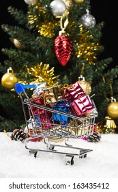 New Year Gift Boxes In Shopping Cart On Snow