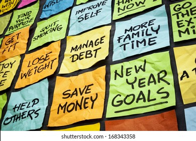 New Year Goals Or Resolutions - Colorful Sticky Notes On A Blackboard