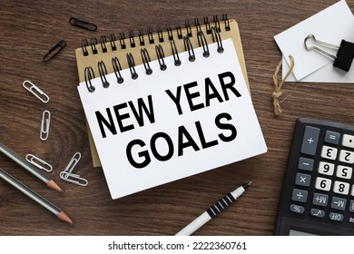 new year goals small office notebook. near the calculator - Shutterstock ID 2222360761