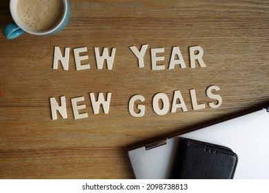 New year new goals written on a desk at a office                       