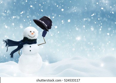 New year greeting card with copy-space.Happy snowman standing in christmas landscape.Snow background - Shutterstock ID 524533117