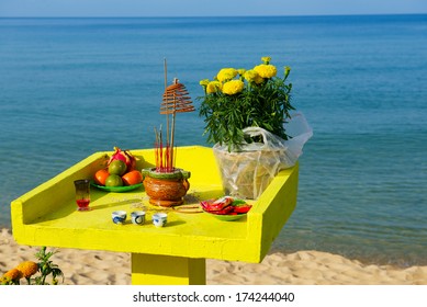 New Year offerings to the gods on the altar of a small sea temple