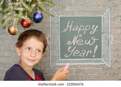 New Year perspectives  Christmas decoration  smiling boy   message chalkboard: Happy New Year!