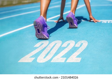 New Year resolution 2022 fitness weight loss challenge athlete woman running at race ready set go motivation for getting in shape.