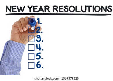 New Year Resolutions Check Box List Hand With Blue Felt Tip Marker Writing