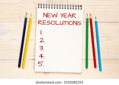 new year resolutions concept, social media post template, minimalistic white wooden table with colorful pencils background - Powered by Shutterstock