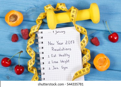 New Year Resolutions Or Goals Eat Healthy, Lose Weight And Join Gym Written In Notebook, Fresh Fruits, Dumbbells For Fitness And Tape Measure