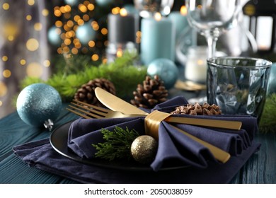 New Year table setting with bokeh on wooden table.