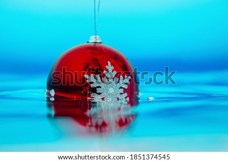 new year tree decoration in the water, christmas decoration in blue water