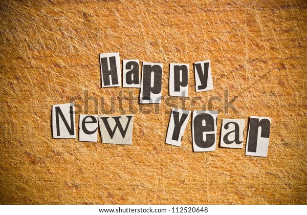 New Year\
wishes. Shot with newspaper\
letters.