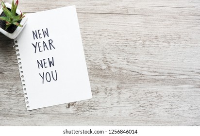 New Year New You Text On Notepad. Business Motivation, Inspiration Concept. Top View Wit Copy Space.