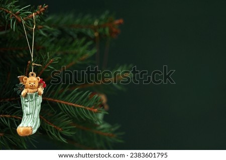 New Year's background with decorations on the Christmas tree on a green background, copy space