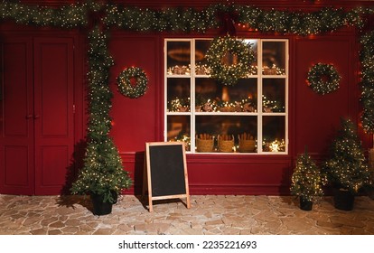 New Year's decorations of the street. Christmas trees with garlands, store window - Powered by Shutterstock