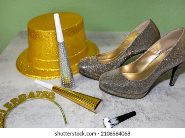 New Years Eve Background With View Of Sparkling Shoes And Gold And Silver Party Favors With Depth Of Field.