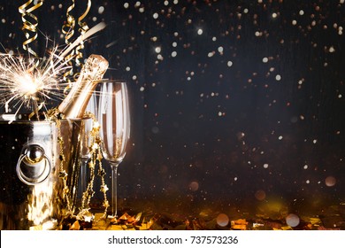 New Years Eve Celebration Background With Champagne. New Years Eve Celebration Background With Pair Of Flutes And Bottle Of Champagne 