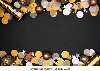 New Years Eve Double Border Of Confetti, Decorations And Noisemakers. Top View Over A Black Background.