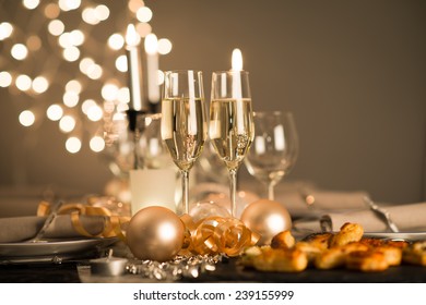 New Years Eve Party Table With Champagne Flute Ribbon And Golden Glitter 