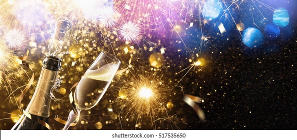 New Year's fireworks with glasses of champagne. Holiday background