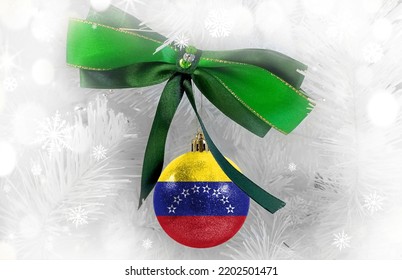 New Year's Glass Ball With The Flag Of Venezuela Against A Colorful Christmas Background