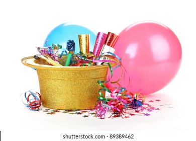 New Year's Hat Filled With Noise Makers, Streamers And Balloons On White Background.