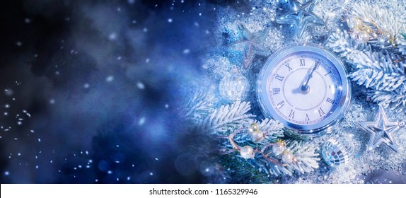 New Year's at midnight - Old clock with stars snowflakes and holiday lights. Christmas and New Year background - Powered by Shutterstock