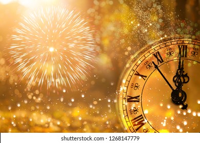 New Year's at midnight - Old clock with fireworks and holiday lights - Shutterstock ID 1268147779