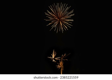New Year's Night, Diwali, bonfire night Colourful Starbursts and Rocket Explosions on Black Background Sky with Red, Green, Blue, Purple, Gold Colour Fireworks Bursts with Space for Text-Smoke-free