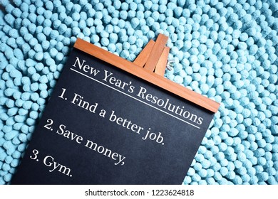 New Years Resolution Written On Black Board, 1. Find A Better Job. 2. Save Money. 3. Gym.