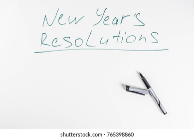 New Years Resolutions, White Board Background With Pen, Copy Space