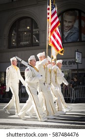 NEW YORK - 11 NOV 2016: Vets In White Uniforms From The American Legion Honor Guard Carry The American Flag In Americas Parade Up 5th Avenue On Veterans Day In Manhattan.