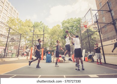 NEW YORK - 16 SEPTEMBER 2016: American Kids Playing Basketball At West 4th Street Courts