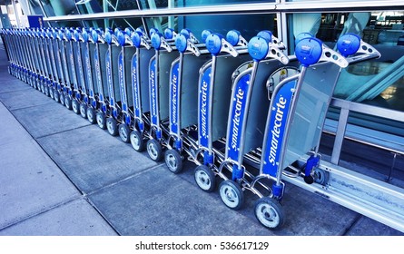 NEW YORK -27 NOV 2016- File Of SmarteCarte Paying Luggage Carts Awaits Passengers On The Curb  At The John F. Kennedy International Airport (JFK).