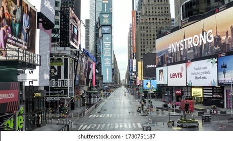 NEW YORK - APR 25, 2020: Empty Times Square City Street With NY STRONG Billboard Giving Hope During Coronavirus COVID-19 Pandemic Lockdown - Nobody Outside In Manhattan NYC.