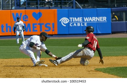 NEW YORK - APRIL 11: Morgan Ensberg #14 of the Houston Astros slides into second base against Jose Reyes #7 at Shea Stadium April 11, 2005 in Flushing, New York