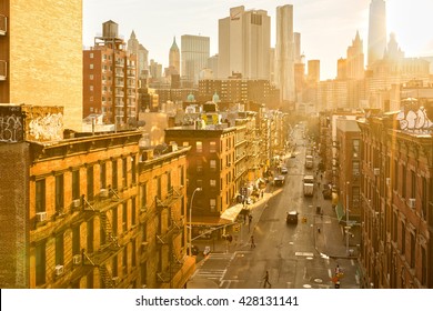 NEW YORK - APRIL 18, 2015: Madison Street in Manhattan's Chinatown on a sunny afternoon. Chinatown is home to the largest enclave of Chinese people in the Western Hemisphere