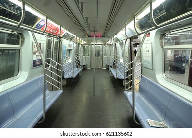 NEW YORK - APRIL 4, 2017: Inside Of NYC Subway Car At Eighth Avenue Station In Manhattan. Owned By The NYC Transit Authority, The Subway System Has 469 Stations In Operation