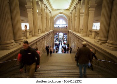 NEW YORK, NEW YORK - APRIL 5, 2018: People Climb Up And Down The Stairs Of The Metropolitan Museum Of Art In New York City