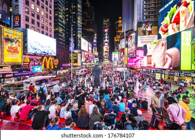 NEW YORK, NEW YORK - APRIL 9, 2013: Times Square crowds at night in Midtown Manhattan. The site is regarded as the world's most visited tourist attraction with nearly 40 million visitors annually.