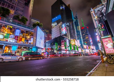 NEW YORK - AUG 10, 2015: Manhattan street view at night in New York City with light beams of traffic. - Shutterstock ID 555258718