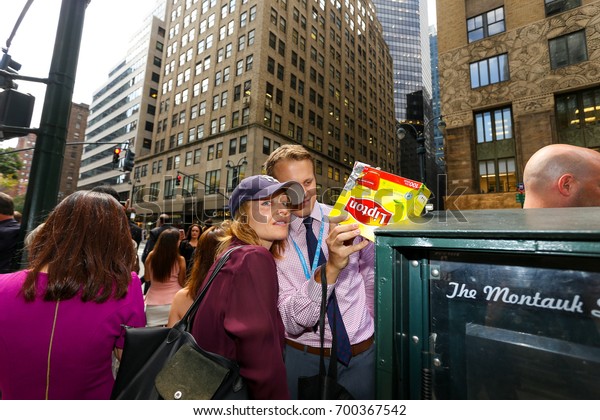 NEW YORK - AUGUST 21:  People Look Through Home\
Made Eclipse Viewers Made Out of Cereal Boxes As They Try and View\
Eclipse On And Near 42nd Street By Grand Central August 21, 2017 in\
New York City.