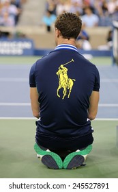 NEW YORK - AUGUST 26, 2014: Ball boy on tennis court at the Billie Jean King National Tennis Center during US Open 2014 in New York
