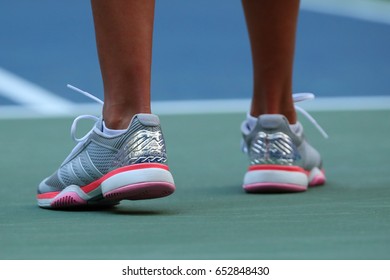 NEW YORK - AUGUST 30, 2016: Professional Tennis Player Kateryna Kozlova Of Ukraine Wears Custom Adidas By Stella McCartney Tennis Shoes During Match At US Open 2016 