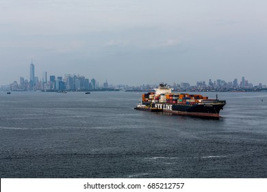 NEW YORK, NEW YORK - August 31, 2013: New York Harbor is one of the largest harbors in the world, and is always full of everything from fishing and pleasure boats to giant freighters and cruise ships.
